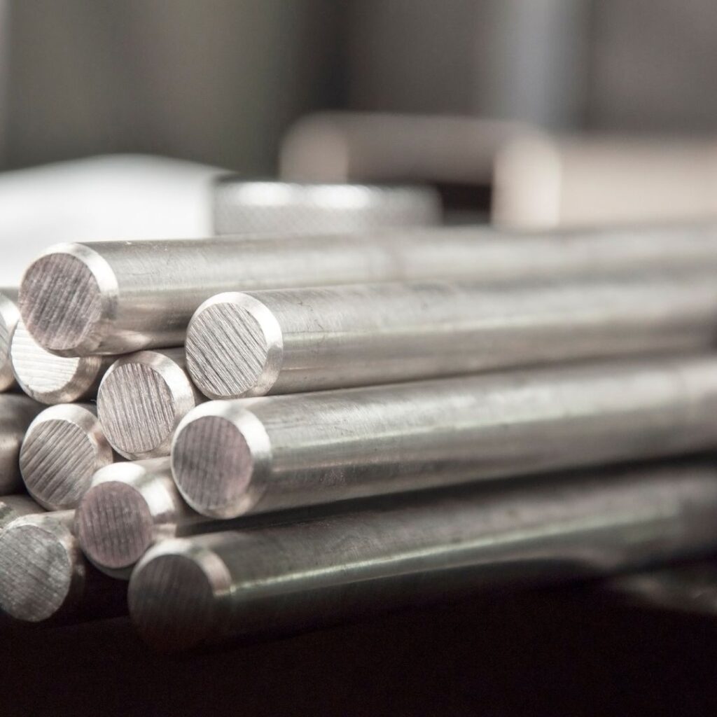 Raw steel rods and materials used in CNC machining services at Jet Machine.